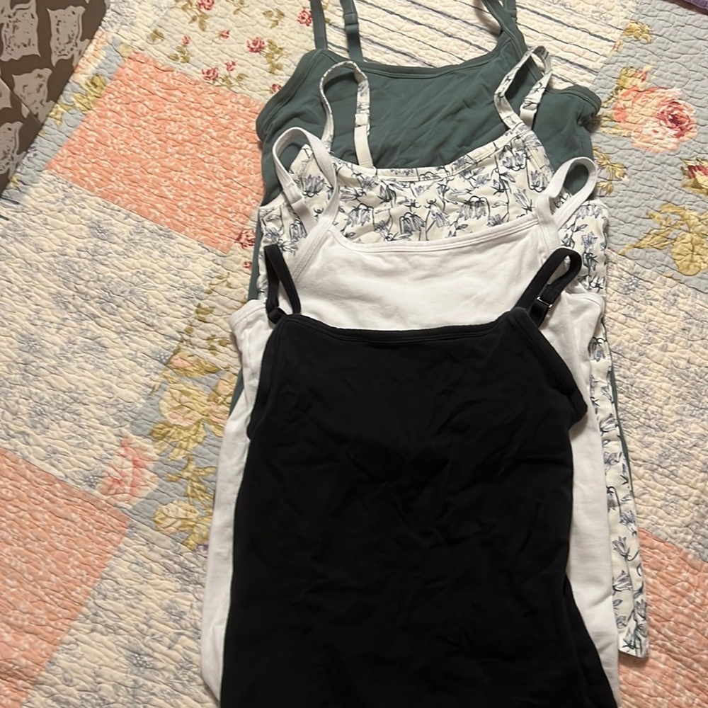 Four Duluth tanks tops with built in shelf bra.